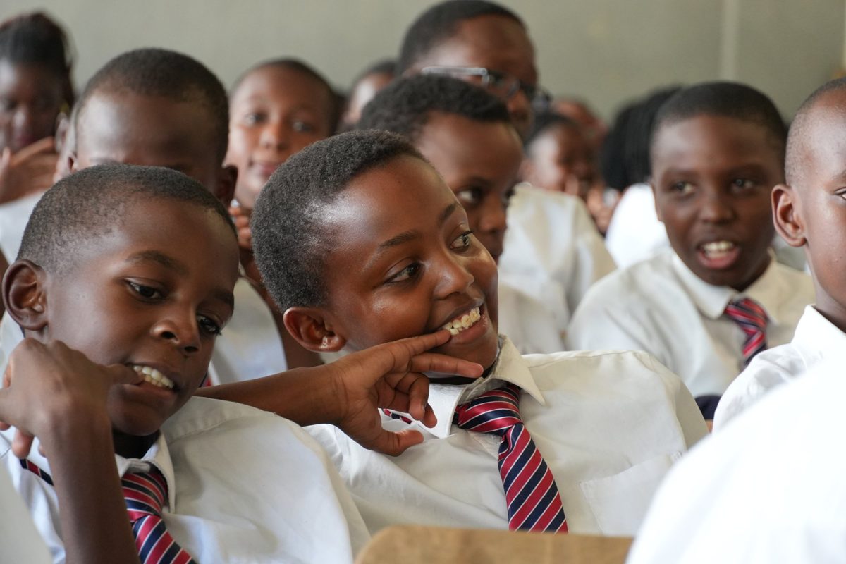 Boys laughing together in a Junior Secondary classroom