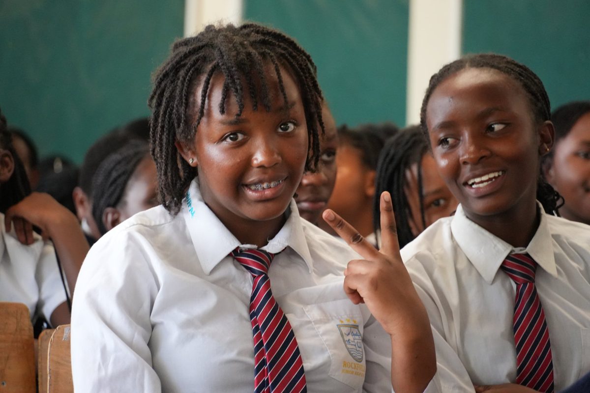 A Grade 8 girl smiling in class