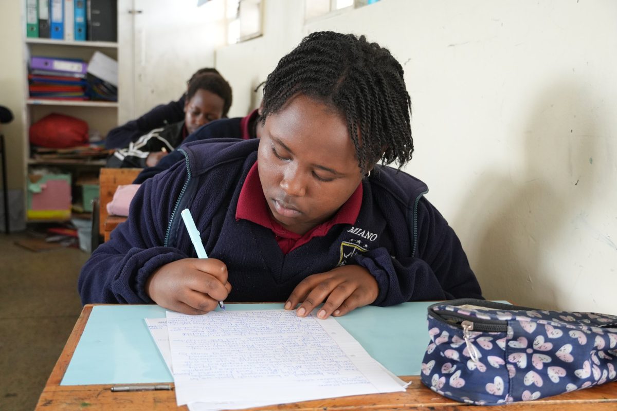 A pupil concentrating on written work